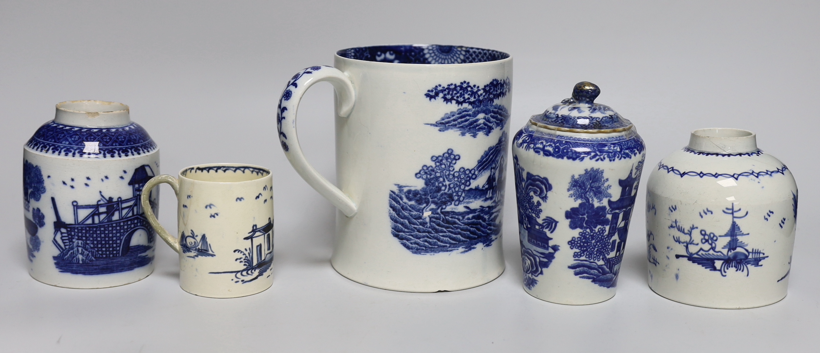 A group of mixed late 18th/early 19th century blue and white pearlware etc. tea canisters and mugs, the largest 14cm high